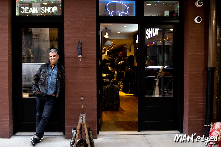 Eric Goldstein standing in front of Jean Shop SOHO location New York City