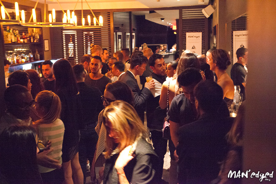 Guests mingling and mixing at one of Parlor's two bars.