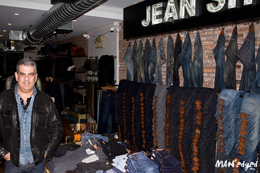 Eric Goldstein standing inside of his 13 year old denim empire called Jean Shop