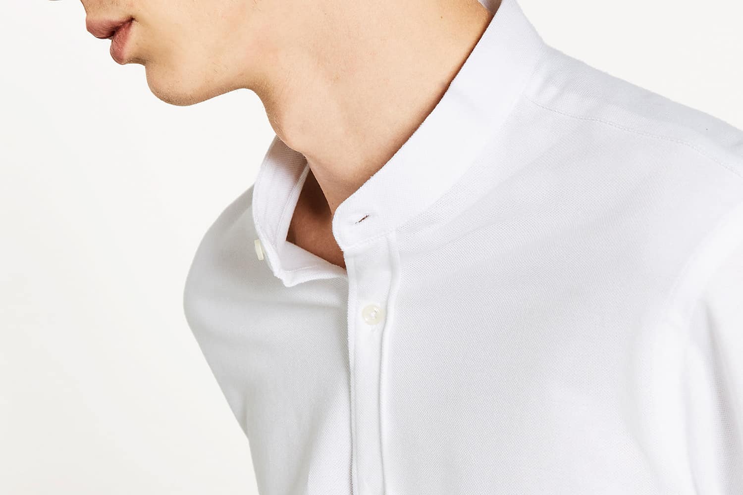 Young man wearing the editor's pick madarin collared shirt and looks like a style expert