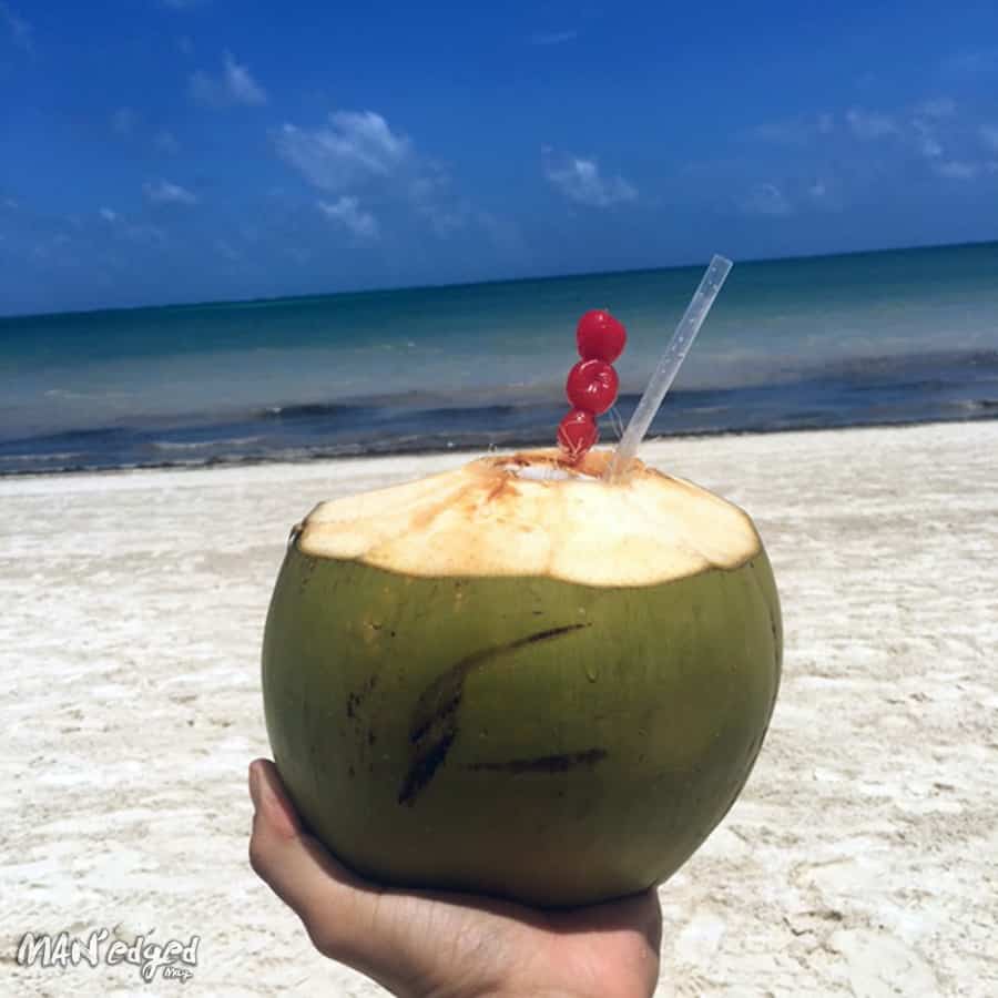 Coconut margarita cocktail on the private beaches of Palace Resorts Moon Palace Cancun.