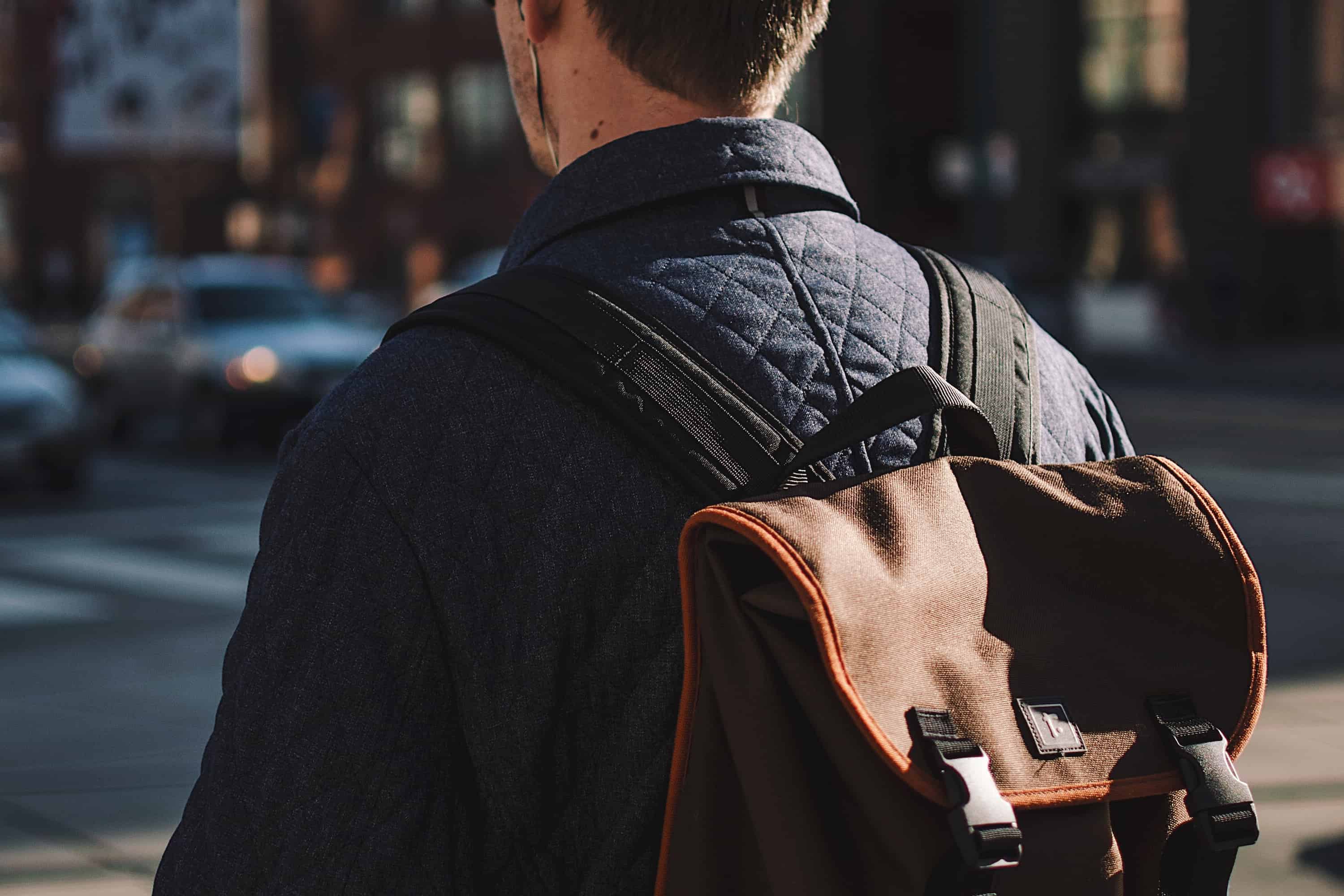 Young man wearing backpack for MAN'edged Magazine Editor's Pick