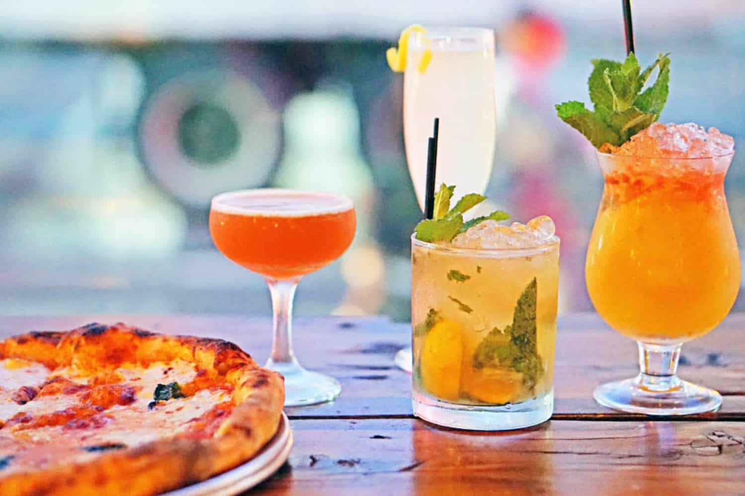 Pizza from Wheater restaurant with various cocktails