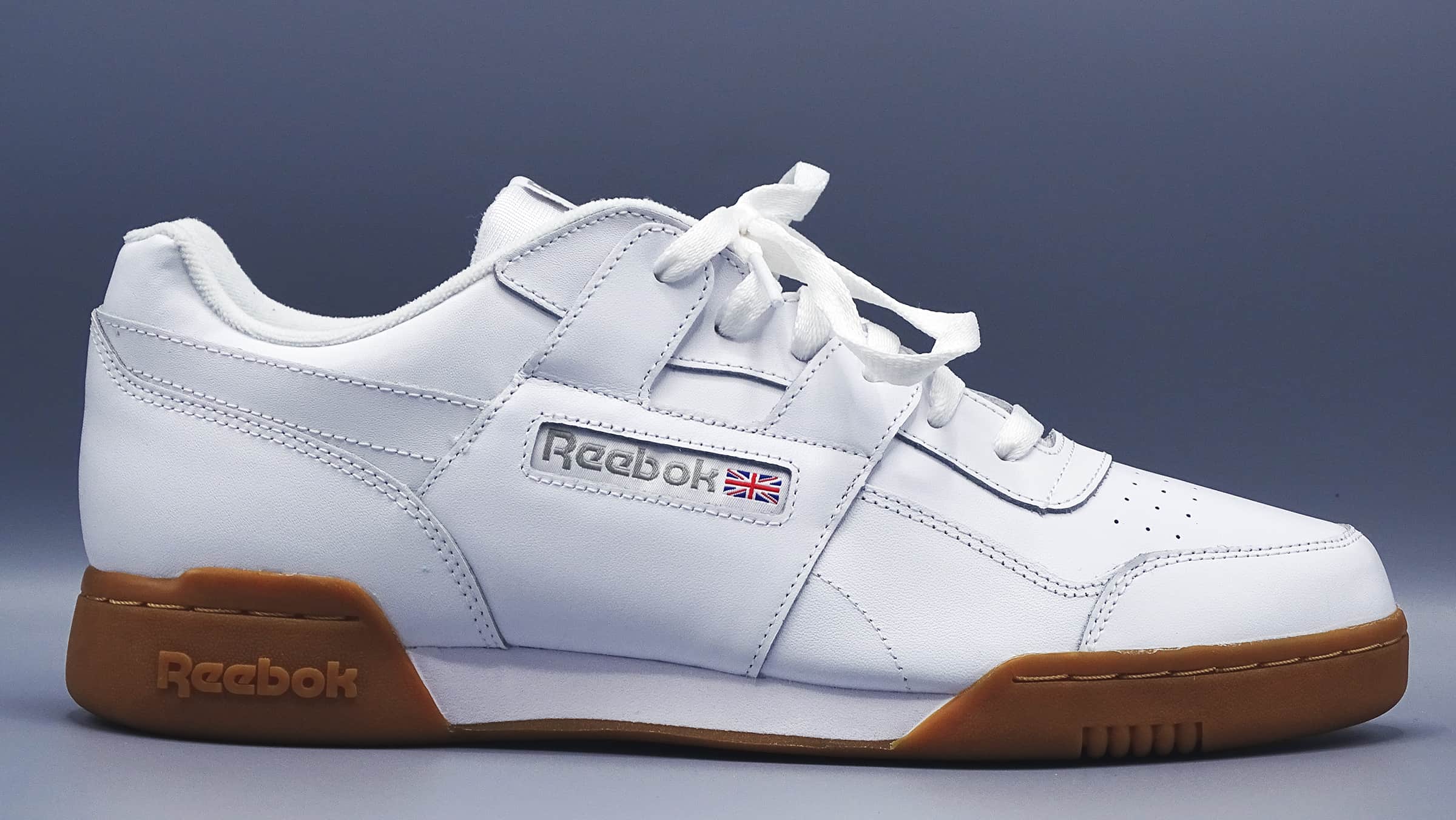 White men's reebok sneaker with gum colored bottom