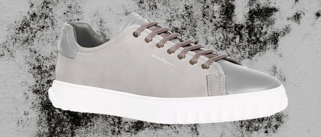 Gray Salvatore Ferragamo Leather Low-Top sneakers with dark gray shoe laces. 
