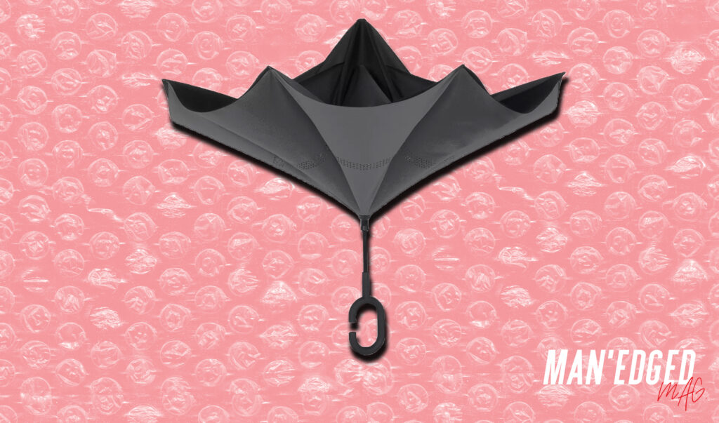 Black men's shedrain reversible umbrella via bloomingdales.com featuring in MAN'edged Magazine men's Editor's Pick