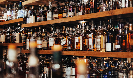 Bar stocked with whiskey and various alcohol botles