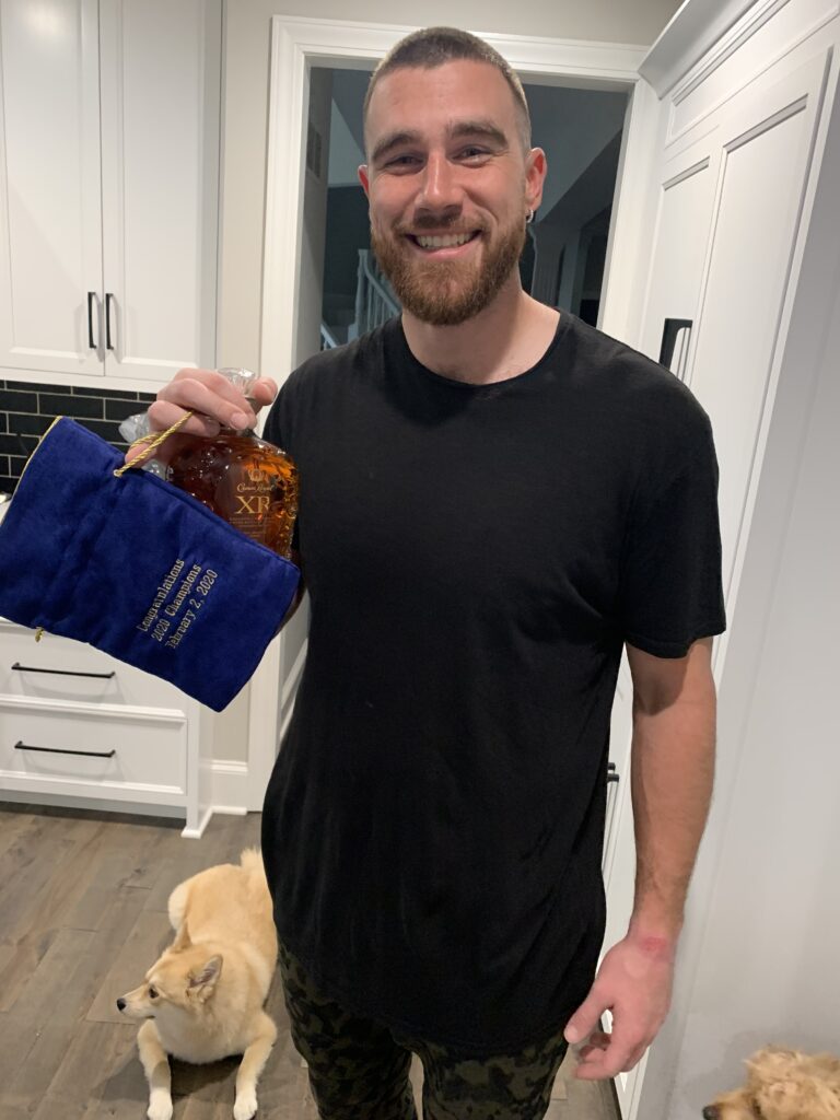 NFL Championship Player, Kelcey Travis of the Kansas City Chiefs holding a bottle of Crown Royal Xr