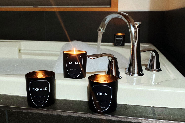 HOME'edged NYC Luxury Candles Burning next to bath at grist iron brewery