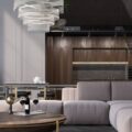 A dark gray-themed living room in a modern, high ceiling home. The furniture is sleek with bronze as its primary accent color.